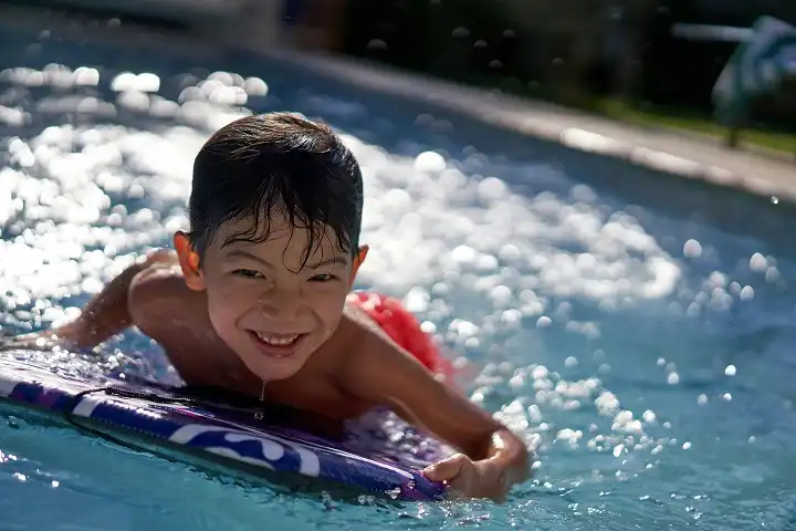Children need a special approach to learning to surf. Image: Drew Gilliam